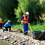 Home 9 **
"A vibrant scene of community volunteers, fully clothed in appropriate attire, working together to clean up a riverbank in the Italian countryside. Diverse group of people, including children and adults, are planting native trees and removing trash. Clear blue sky, sparkling river, lush green vegetation. Safe for work, appropriate content, family-friendly. Perfect anatomy, correct proportions, natural pose, well-formed hands, proper finger count, natural body proportions, professional photography, high quality."
**
